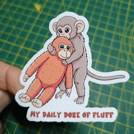 Pung-yo Punch Monkey Sticker - "My Daily Dose of Fluff" Viral Monkey and Plushie Decal - Cute Baby Monkey Holding Orange Toy